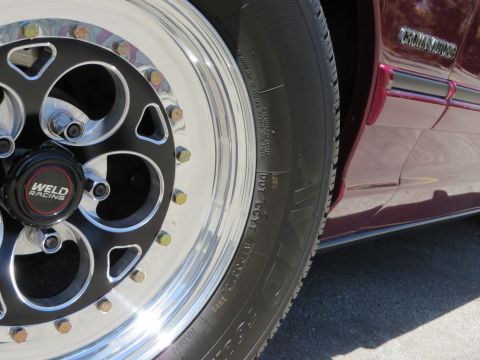 1992 Ford Crown Victoria - A Weld Racing wheel is mounted on the side of a 1992 Ford Crown Victoria.