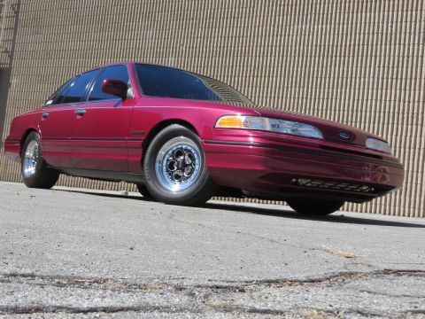 1992 Ford Crown Victoria - This 1992 Ford Crown Victoria features distinctive Weld Magnum III wheels, adding a custom touch to its classic sedan profile.