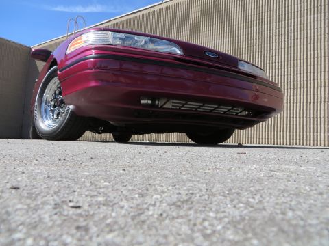 1992 Ford Crown Victoria - Front view of a maroon 1992 Ford Crown Victoria with chrome wheels.