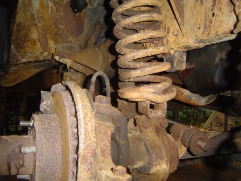 1986 Ford Bronco - Heavily rusted suspension parts are visible in this close-up view.