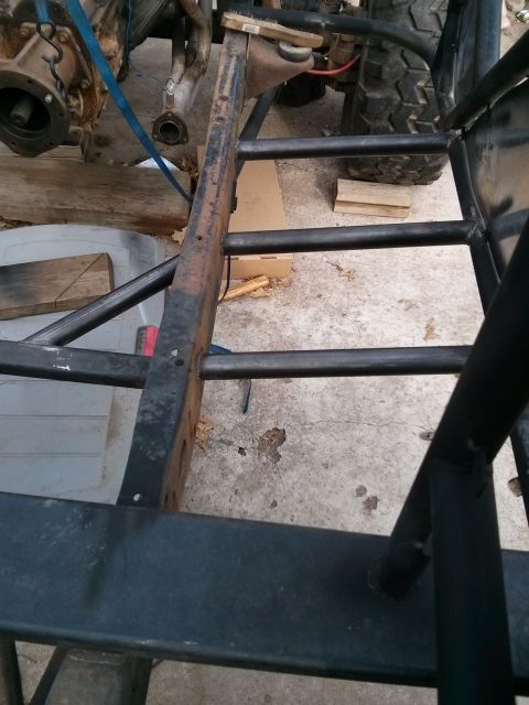1986 Ford Bronco - Frame and engine components of a vehicle under repair or modification.