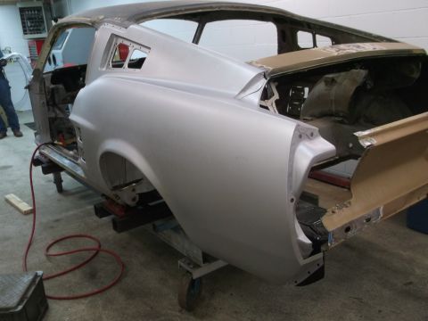 1967 Ford Mustang - Body shell of a 1967 Ford Mustang undergoing restoration, showing the rear quarter panel and trunk area.