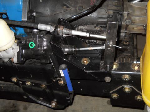 1992 Ford Bronco - Detail of the mechanical linkage connecting to a vehicle's transmission system.