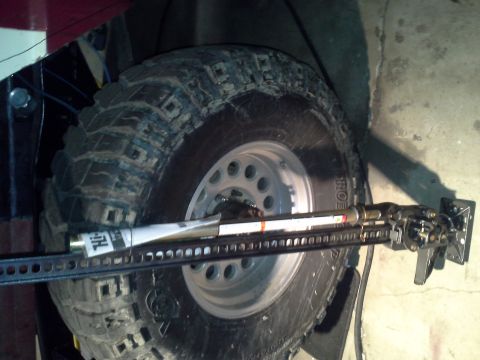 1968 Ford Bronco - A hi-lift jack is attached to the spare tire, suggesting off-road use.