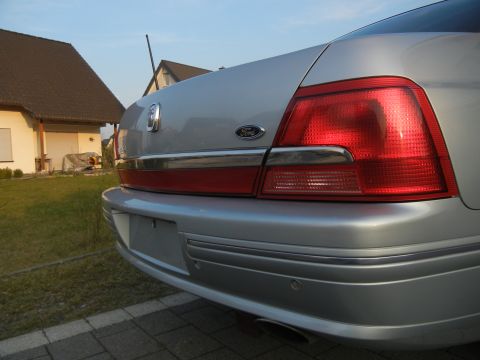 1999 Ford Fairlane - The Ford badge is visible on the trunk lid of this silver sedan.