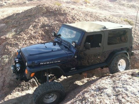 2005 Jeep Wrangler - 2005 Jeep Wrangler Rubicon tackling rough off-road trails in a desert environment.