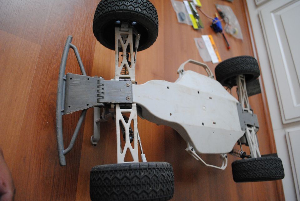 Remote control car chassis with suspension and tires, viewed from above