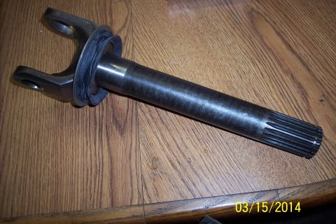 1973 Ford F-250 - Front axle shaft with U-joint yoke and splined end, likely for a truck.