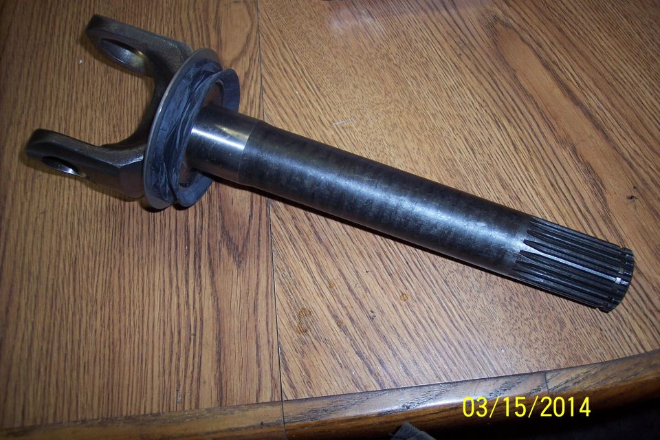 Front axle shaft with U-joint yoke and splined end