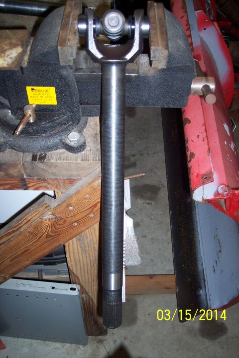 1973 Ford F-250 - Driveshaft U-joint and yoke clamped in a vise, with a date stamp of 03/15/2014.