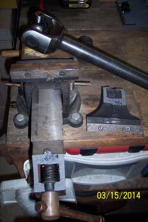 1973 Ford F-250 - A driveshaft universal joint is secured in a vise, with a portion of the driveshaft visible. The date 03/15/2014 is stamped on the image.