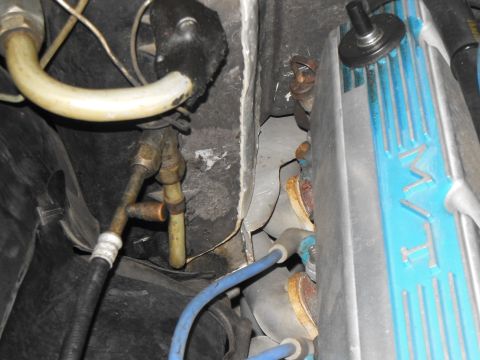 1979 Ford Ranchero - Engine bay detail with AC lines and a valve cover. No year is discernible.