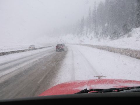 2009 Kenworth T800 - Driving through a snowstorm on a highway with limited visibility.