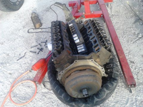 1988 Ford Bronco - DAY 2: Pulled the old seized motor out. Since the motor was seized, I couldn't get to the torque converter nuts and had to pull the torque…