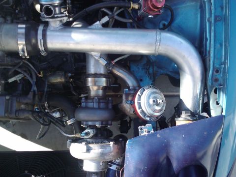 1995 Ford Probe - Custom turbo setup with large intercooler piping and wastegate visible.