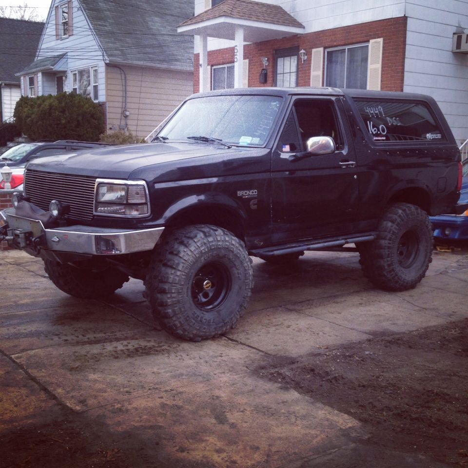 Black 1995 Ford Bronco with lifted suspension and large tires