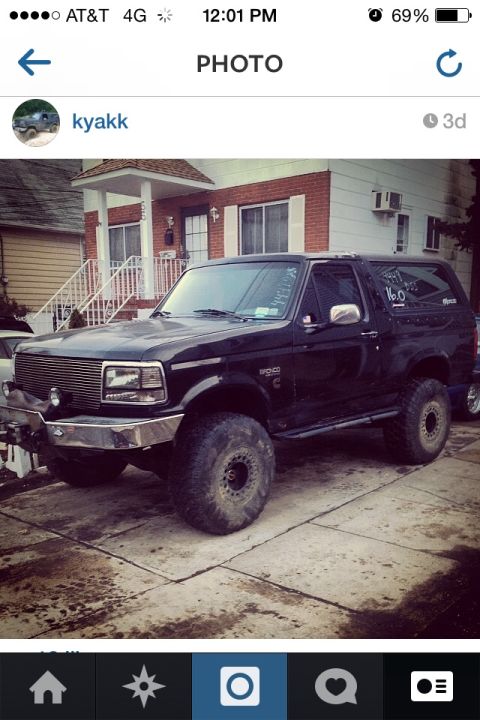 1995 Ford Bronco - This 1995 Ford Bronco is modified with large off-road tires and sits in a driveway.
