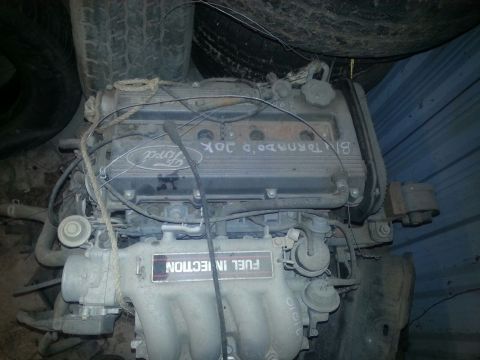 1991 Ford Festiva - Engine with Ford branding and 'FUEL INJECTION' label visible.