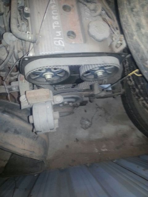 1991 Ford Festiva - Close-up view of an engine's timing belt system, showing the belt and pulleys.