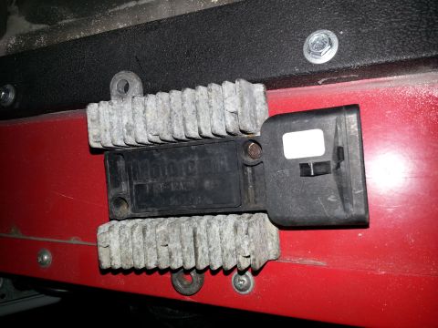 1994 Ford Bronco - Close-up of an electronic control module with visible text and a white label.