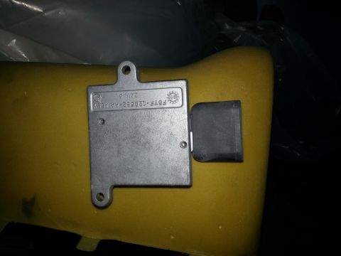 1994 Ford Bronco - Close-up of a Ford electronic control module, part number F5TF-12B562-AA, is visible.