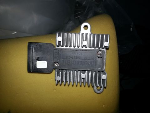 1994 Ford Bronco - A close-up view of a vehicle's blower motor resistor with visible part identification.