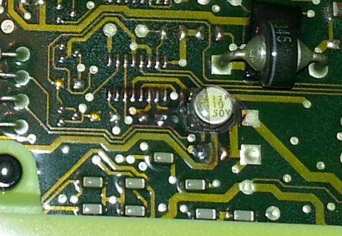 1994 Ford Bronco - A detailed view of an electronic circuit board, various components like capacitors and diodes, with some visible text markings.