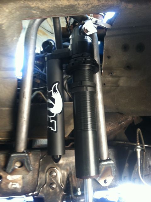1977 Ford F-350 - Aftermarket Fox shocks are installed on the vehicle's suspension system.
