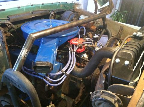 1977 Ford F-350 - Close-up of a vehicle's engine bay, a prominent blue air cleaner and a red MSD ignition distributor.
