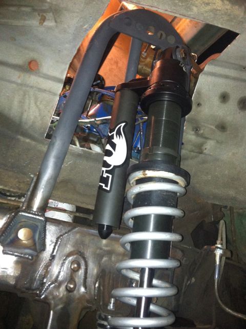 1977 Ford F-350 - Custom coilover suspension a Fox shock absorber and silver spring. Part of a vehicle's chassis modification.