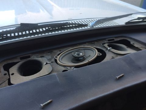 1964 Ford Ranchero - The dashboard speaker opening is visible, with one speaker removed and two screws on the dashboard.
