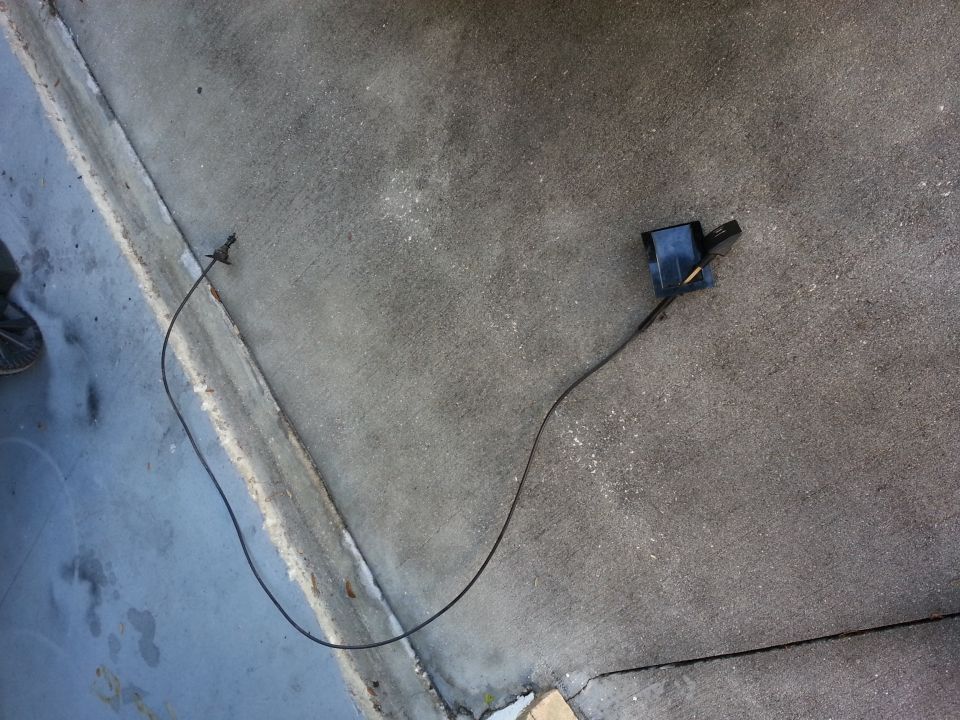 Hood latch cable and mechanism on concrete ground
