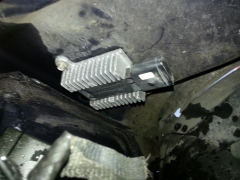 1994 Ford Bronco - A Motorcraft voltage regulator with a prominent heat sink is visible, likely mounted under the hood.