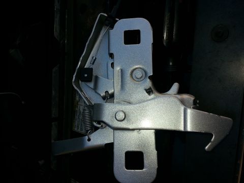 1994 Ford Bronco - Close-up of a vehicle's hood latch mechanism.