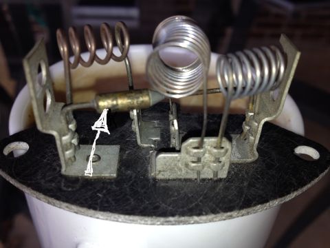 1983 Volkswagen Rabbit - Close-up of a heater blower motor resistor, showing its internal components and mounting points.