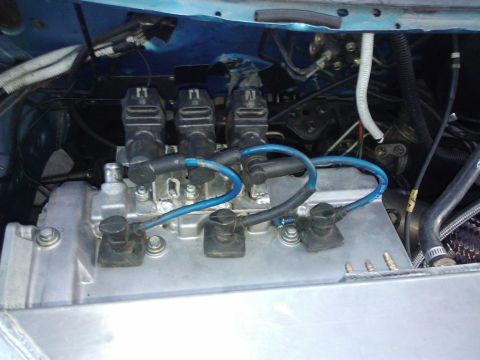 1995 Ford Probe - Engine bay detail with ignition coils and blue spark plug wires visible.