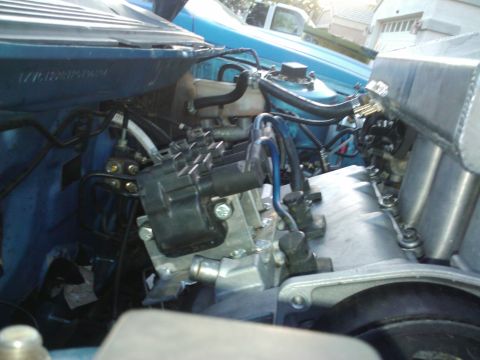 1995 Ford Probe - Close-up view of a vehicle's engine bay, highlighting various components and wiring.