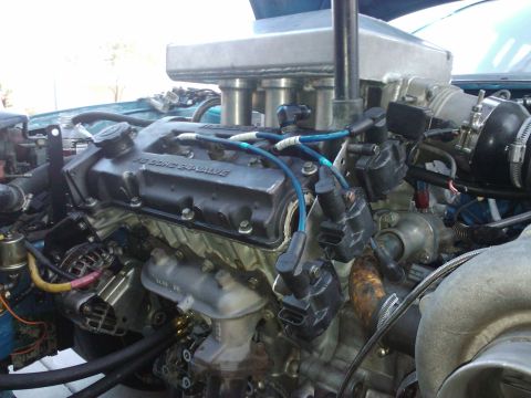 1995 Ford Probe - Close-up view of a modified V6 engine, showing custom intake and engine components.