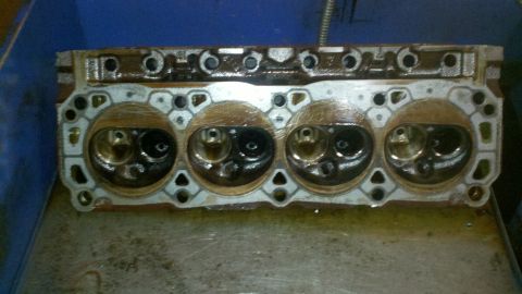1989 Ford F-150 - A close-up view of an engine cylinder head, revealing its internal components and condition.
