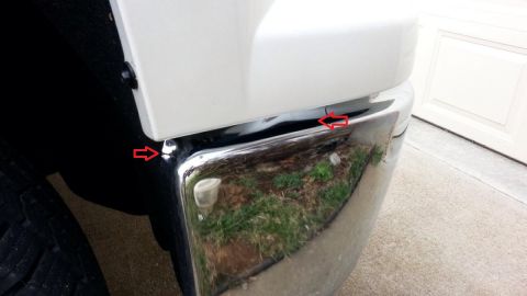 2000 Ford Crown Victoria - Close-up view of a chrome bumper, with red arrows highlighting areas of damage. The registry information for a 2000 Ford Crown Victoria doe…