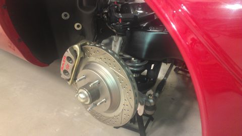 1972 Pontiac Trans Am - This image shows a close-up of a car's front brake system, a drilled rotor and a Baer caliper.
