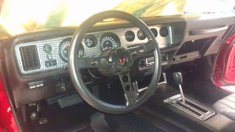 1972 Pontiac Trans Am - Interior view of a 1972 Pontiac Trans Am, the iconic bird emblem on the steering wheel and a full dashboard display.