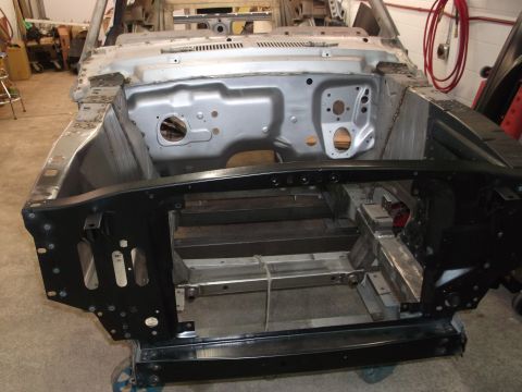 1967 Ford Mustang - This vehicle chassis is undergoing restoration, with much of its original body removed.