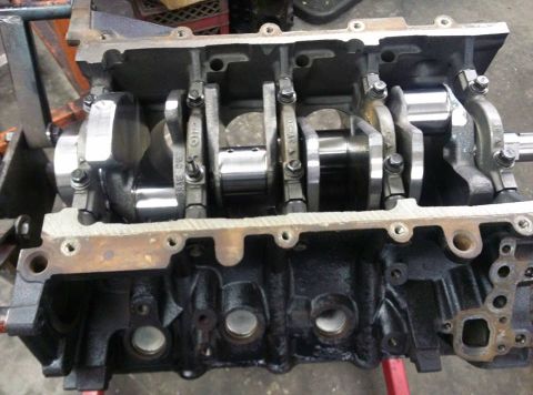 2004 Ford Crown Victoria - Internal view of an engine block with crankshaft and connecting rods visible.
