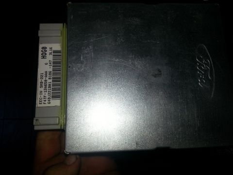1994 Ford Bronco - A Ford EEC-IV engine control unit is shown, identified by its part number and barcode.