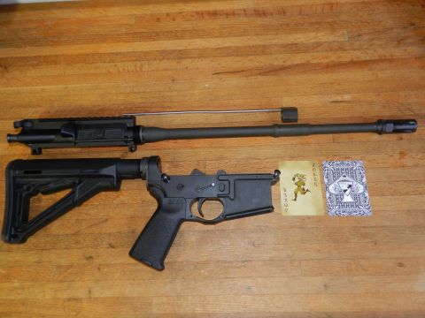 1996 Ford Bronco - AR-15 upper receiver, barrel, and lower receiver with stock are laid out on a wooden surface next to playing cards.
