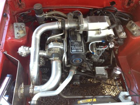1995 Ford Probe - Close-up of a modified Ford engine with turbocharger and custom piping.