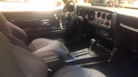 1972 Pontiac Trans Am - Interior view of a 1972 Pontiac Trans Am, showing the dashboard, steering wheel, and center console with automatic shifter.