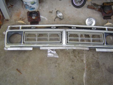 1986 Ford Bronco - Front grille assembly with Ford lettering, likely from a truck or SUV.