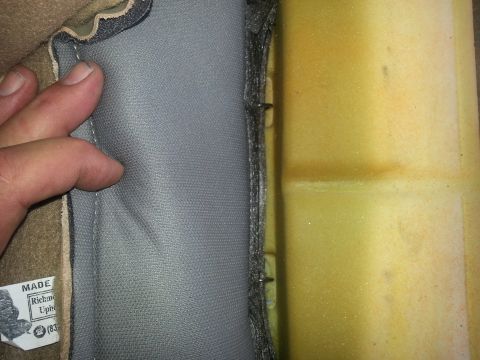 1994 Ford Bronco - Close-up of car seat foam and upholstery, showing a 'MADE IN Richmond Uph.' label.